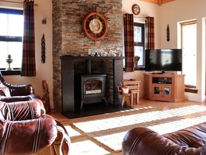 Brown, Property, Furniture, Window, Wood, Living Room, Hearth, Picture Frame, Comfort, Flooring