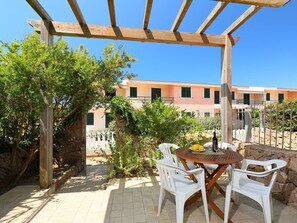 Plant, Property, Sky, Table, Furniture, Shade, Chair, Building, Lighting, Architecture