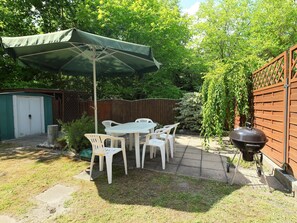 Furniture, Plant, Table, Tree, Nature, Chair, Outdoor Table, Shade, Outdoor Furniture, Grass