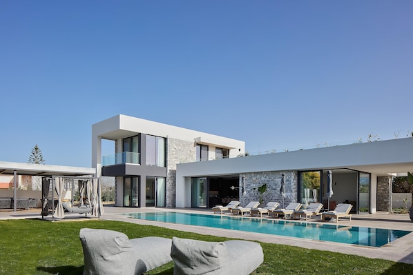 The villa offers a gazebo, 6 sun beds, 2 bean bag loungers, and 4 umbrellas for comfort.