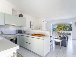 Cabinetry, Countertop, Furniture, Sink, Drawer, Kitchen Stove, Kitchen, Kitchen Appliance, Flooring