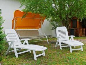 Plant, Furniture, Green, Chair, Nature, Outdoor Furniture, Shade, Armrest, Grass, Tree