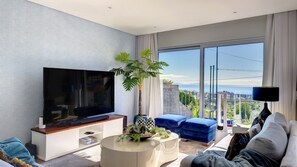 Alternate view captures ocean panorama with distant Desert Islands, enhancing the living room's scenic allure. #decordetails #desertislands #oceanview