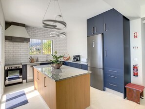 This kitchen combines modern functionality with inviting aesthetics, providing a delightful space to create delicious meals. #kitchen #coffeemachine