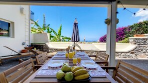 Enjoy a tranquil outdoor breakfast surrounded by sunlight #breakfast #patio #umbrella #sunbeds