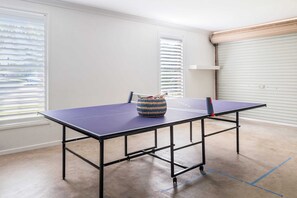 Grab a bat and a ball and have some fun with this ping pong table