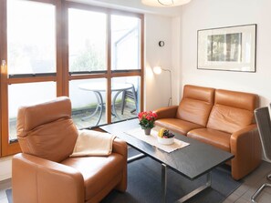 Furniture, Interior Design, Flooring, Floor, Wood, Couch, Room, Living Room, Chair, Table