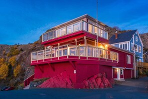 The outside view of this uniquely beautiful home built into a rock-face.