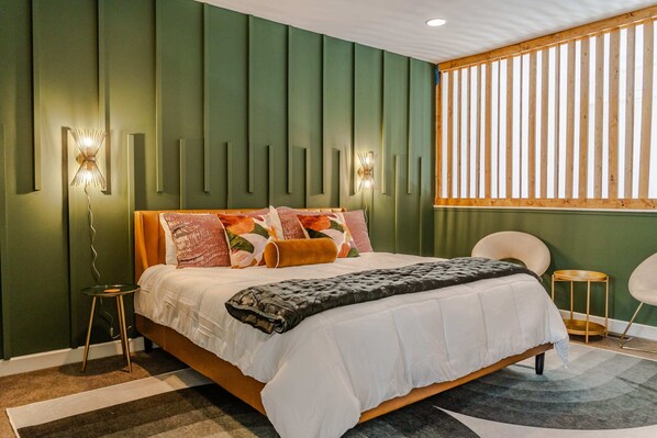Bedroom 1: Step into luxury fit for royalty. Our king bedroom exudes elegance with unique decor that promises a stay worth indulging in. Embrace comfort, embrace opulence, and let your dreams reign supreme.