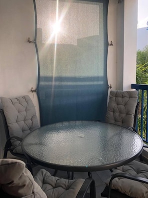 Outside pool view dining for 4