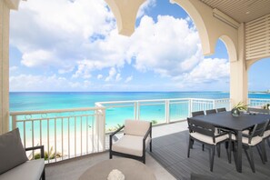 Your private balcony comes furnished with lounge seating and an alfresco dining table. 