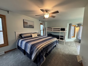Master bedroom with king bed and twin bunk beds