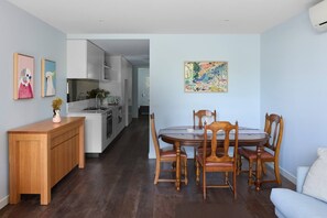 A four-person dining table makes it easy to share a meal at home or use as a dedicated workspace if you’re here on a business trip.
