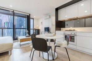 Staying in? Cook up a storm and dine at the round kitchen dining table that can fit up to four guests.
