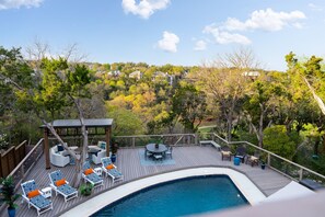 Balcony view of the overlooking hills and outdoor pool.