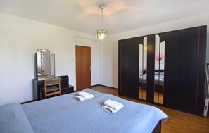 Bedroom 1 with double bed and wardrobe