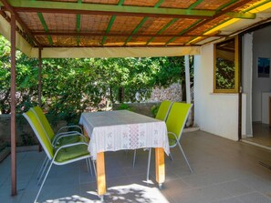 Property, Table, Furniture, Plant, Shade, Outdoor Table, Interior Design, Outdoor Furniture, Chair, Door