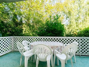 Furniture, Property, Plant, Table, Outdoor Furniture, Shade, Chair, Interior Design, Grass, Leisure