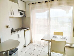 Furniture, Interior Design, Floor, Flooring, Chair, Kitchen & Dining Room Table, Apartment, Room, Kitchen, Countertop