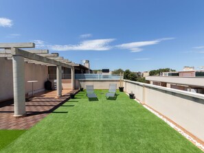 Sky, Cloud, Building, Land Lot, Grass, Urban Design, Shade, Landscape, Facade, Roof