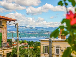 Cloud, Sky, Water, Building, Property, Azure, Window, Mountain, Body Of Water, Lake