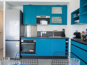 Cabinetry, Blue, Kitchen Appliance, Countertop, Kitchen Stove, Building, Kitchen, Home Appliance, Sink, Line