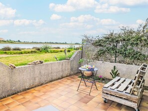 Cloud, Plant, Sky, Furniture, Table, Outdoor Furniture, Natural Landscape, Flowerpot, Wood, Grass