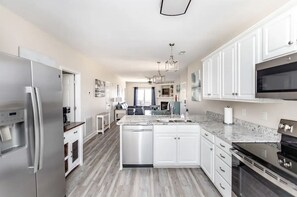 Open flow between kitchen, dining, and living areas
