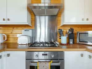 Cabinetry, Countertop, Property, Furniture, Kitchen Sink, Kitchen Appliance, Kitchen, Kitchen Stove, Building, Home Appliance