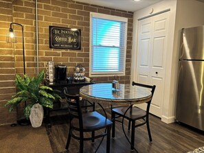 Cozy kitchen table to enjoy a meal, morning coffee, or sip of tea. 