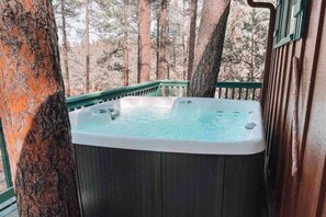Private hot tub on the back deck. Enjoy the mountain air & the stars at night. A perfect place to relax.