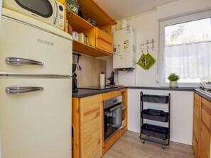 Cabinetry, Countertop, Furniture, Building, Kitchen, Kitchen Appliance, Kitchen Stove, Wood, Home Appliance, Interior Design