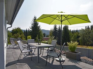 Plant, Table, Furniture, Property, Umbrella, Building, Sky, Tree, Chair, Shade