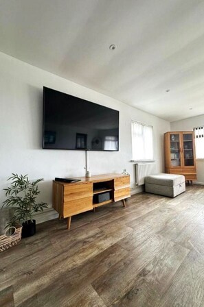 Flooring, Floor, Wood Flooring, Wood, Furniture, Interior Design, Laminate Flooring, Television, Living Room, Television Set