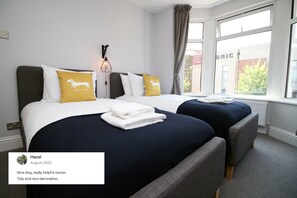 Bedroom two - twin room with bay window, super comfortable mattresses & smart tv