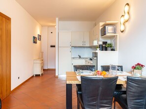 Property, Furniture, Table, Wood, Cabinetry, Flooring, Interior Design, Floor, Door, Living Room