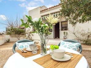 Table, Tableware, Plant, Sky, Property, Furniture, Cloud, Dishware, Window, Building