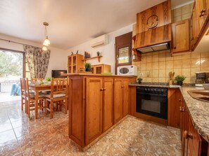 Cabinetry, Countertop, Furniture, Kitchen Appliance, Wood, Kitchen, Home Appliance, Interior Design, Wood Stain, Kitchen Stove