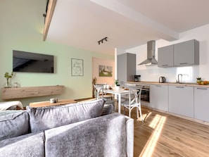 Furniture, Property, Cabinetry, Couch, Plant, Countertop, Houseplant, Picture Frame, Living Room, Interior Design