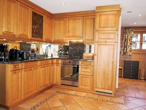 Kitchen, Cabinetry, Flooring, Countertop, Wood, Kitchen Appliance, Furniture, Floor, Interior Design, Major Appliance