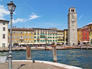 Sky, Water, Cloud, Building, Window, Street Light, Tower, Body Of Water, House, Vehicle