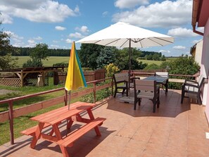 Cloud, Sky, Table, Property, Furniture, Plant, Building, Outdoor Table, Shade, Outdoor Bench