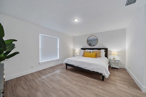 Master bedroom with comfortable king size bed and high quality bed sheets