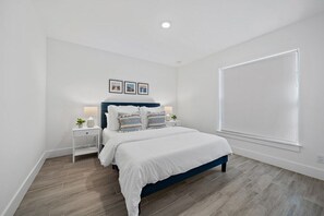 Guest bedroom with comfortable queen size bed and high quality bed sheets