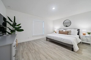 Master bedroom with comfortable king size bed and high quality bed sheets
