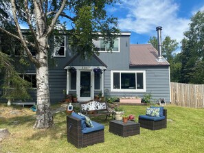 Welcome to our home! Relax under the tree on the comfy front patio.