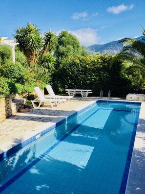 Private swimming pool with sunny patio