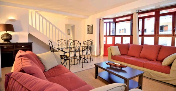 Charming open-plan living and dining area with a warm, inviting ambiance.