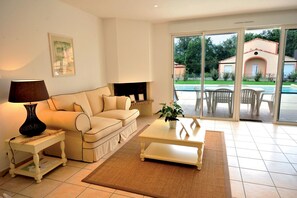 Relax and unwind in our cozy living room, the perfect space for rest after a day of exploration.