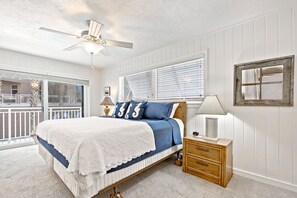 Master Bedroom with a king-sized bed and ocean-view patio.